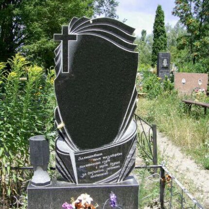 Einzeldenkmal aus Granit - Kreuz und Blütenblätter